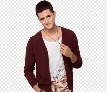 a man wearing a maroon cardigan and a white tank top with a picture of penguins on it