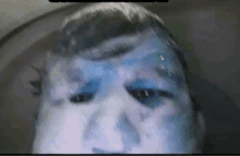 a person with blue paint on their face