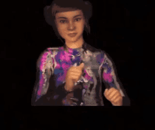 a woman in a floral shirt is giving a thumbs up in a dark room .