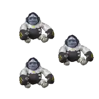 three stuffed gorillas are sitting next to each other