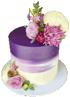 a purple and white cake with flowers on it