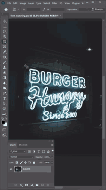 a computer screen shows a neon sign that reads burger hungry since 1903