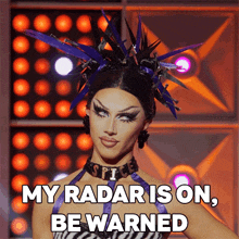 a picture of a drag queen with the words my radar is on be warned