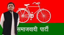 a man stands in front of a red green and white flag with a white bicycle on it