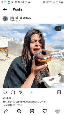 a woman is eating a chocolate donut in a post on instagram