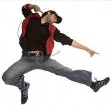 a man is jumping in the air while wearing a red jacket .