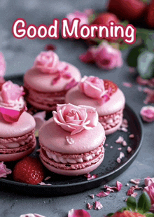 a plate of pink macaroons with roses on top and the words good morning on the bottom