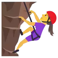 a woman wearing a red helmet is climbing up a rock wall