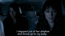 two women sitting in a car with the words i stepped out of her shadow and stood up to my bully