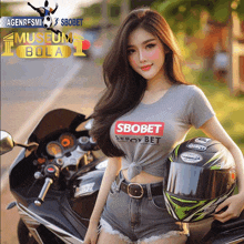 a woman holding a helmet and wearing a shirt that says " sbobet "