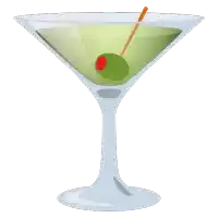 a martini glass with a green olive in it