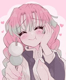 a girl with pink hair is holding a bunch of balls in her hands .