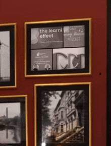 a framed picture of a building with the words " the learni effect " on it