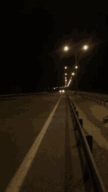 a dark highway with a lot of lights on