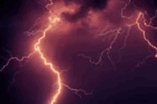 a close up of a lightning bolt in the night sky .