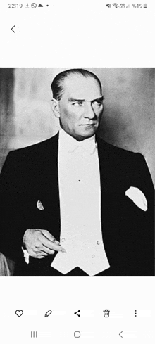 a black and white photo of a man in a suit