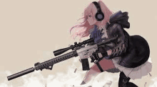 a girl with headphones is holding a sniper rifle in her hand .