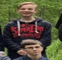 a group of young men are posing for a picture together .