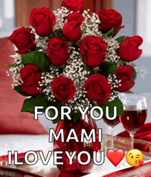 a bouquet of red roses in a vase with the words " for you mami i love you " below it