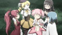 a group of anime girls are standing around each other in a field .