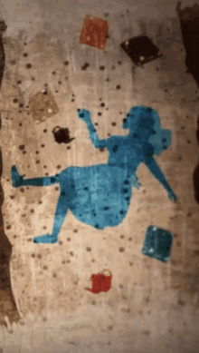 a painting of alice from alice in wonderland laying on the floor