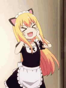 a girl in a maid costume with cat ears is standing in a doorway .