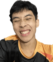 a young man wearing glasses and a black and gold shirt smiles with his eyes closed