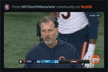 a man wearing a headset watches a football game between the chicago bears and detroit lions