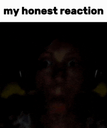 a blurred image of a person 's face with the words " my honest reaction " below it