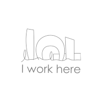 a logo that says ' i work here ' on the bottom