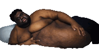 a man with a beard is laying down with his hands on his belly