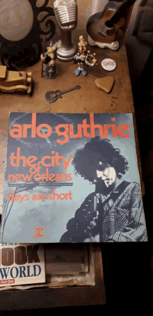 a record of arlo guthrie 's the city new orleans days are short sits on a table