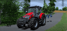 a red tractor is driving down a road with trees in the background