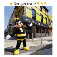 a picture of a mascot in front of a jollibidadbida restaurant