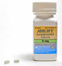 a bottle of abilify 2 mg tablets next to a smaller tablet