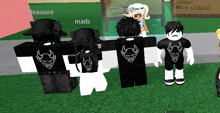 a group of roblox characters standing in front of a sign that says reassure