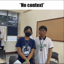 a boy and a girl wearing face masks in a classroom with the caption " no context " above them