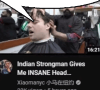 a video of a man getting his hair cut with a speech bubble saying indian strongman gives me insane head