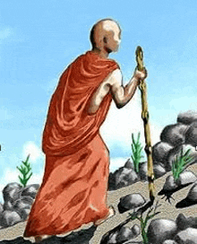 a bald man in a red robe is walking down a rocky path with a cane .