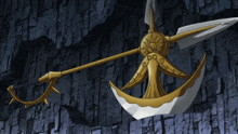 a sword with a crescent moon on it is hanging on a stone wall