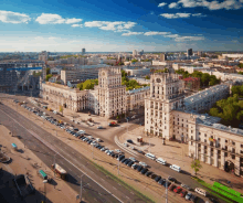 an aerial view of a city with a clock tower on top of a building