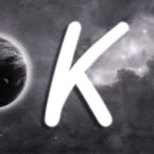 a black and white photo of the letter k in front of a planet