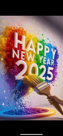 a person is holding a paint brush and painting the words happy new year 2025 .