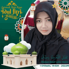 a woman in a black hijab is on a greeting card for idul fitri