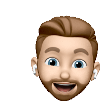 a man with a beard wearing ear buds is smiling