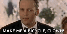 a man in a tuxedo and bow tie is asking someone to make him a bicycle , clown .