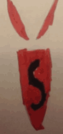 a red object with a black s on it