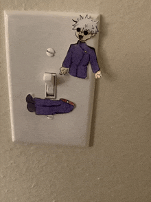 a light switch with a drawing of a person on it that says " on "