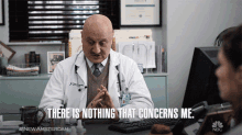 a doctor sitting at a desk talking to a patient with the words " there is nothing that concerns me "