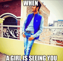 a man in a blue vest is standing on a balcony with a caption that says when a girl is seeing you